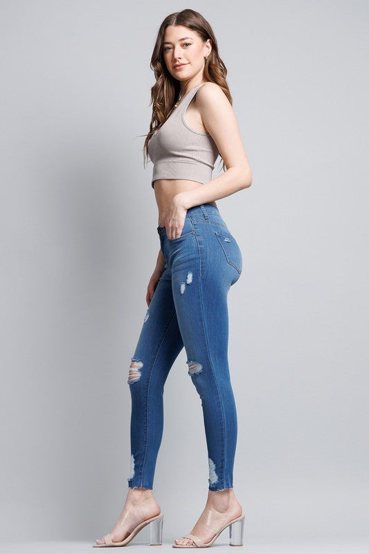 Distressed Mid Rise Skinny Jeans with Chewed Hems