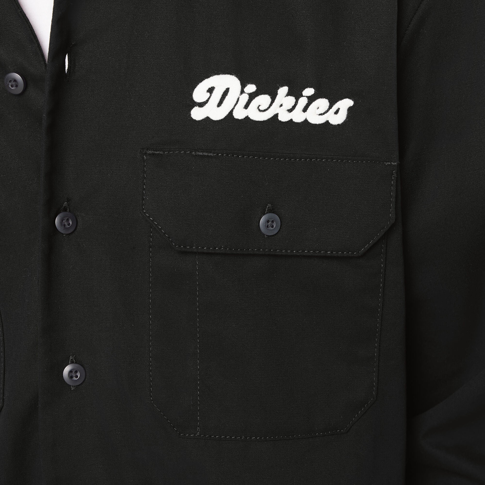Black shirt with 'Dickies' logo on a pocket