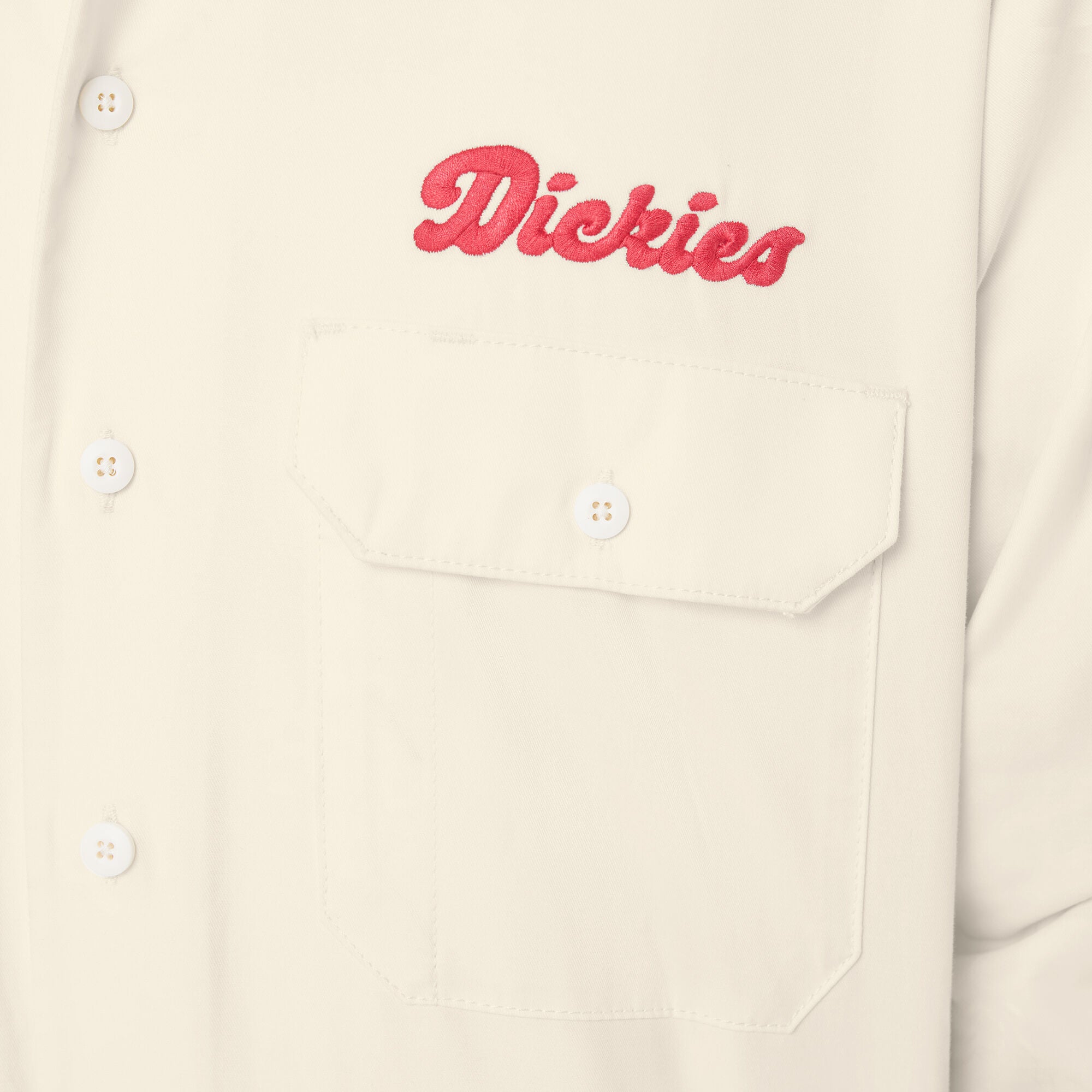 Beige shirt with red 'Dickies' logo on a beige background